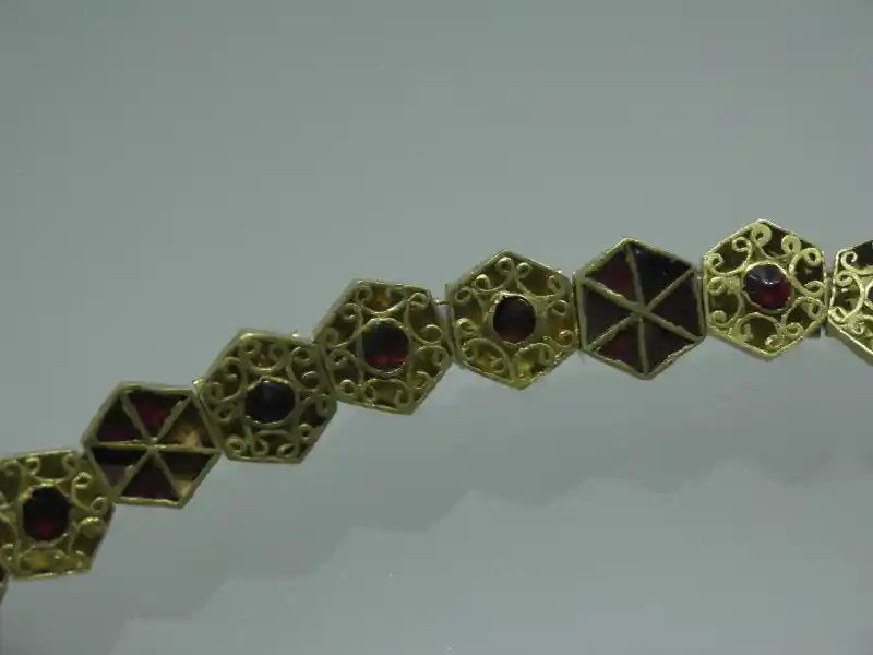 Gold necklace with hexagon design, six-pointed crosses
